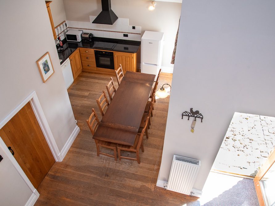 Kitchen and dining area in in The Edge cottage at Rushop Hall, the Peak District - perfect for larger groups and families