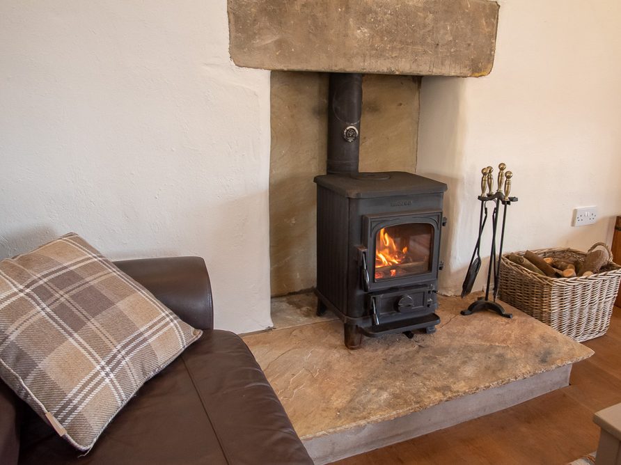 Living room with fire in Top Tack self-contained cottage, Rushop Hall